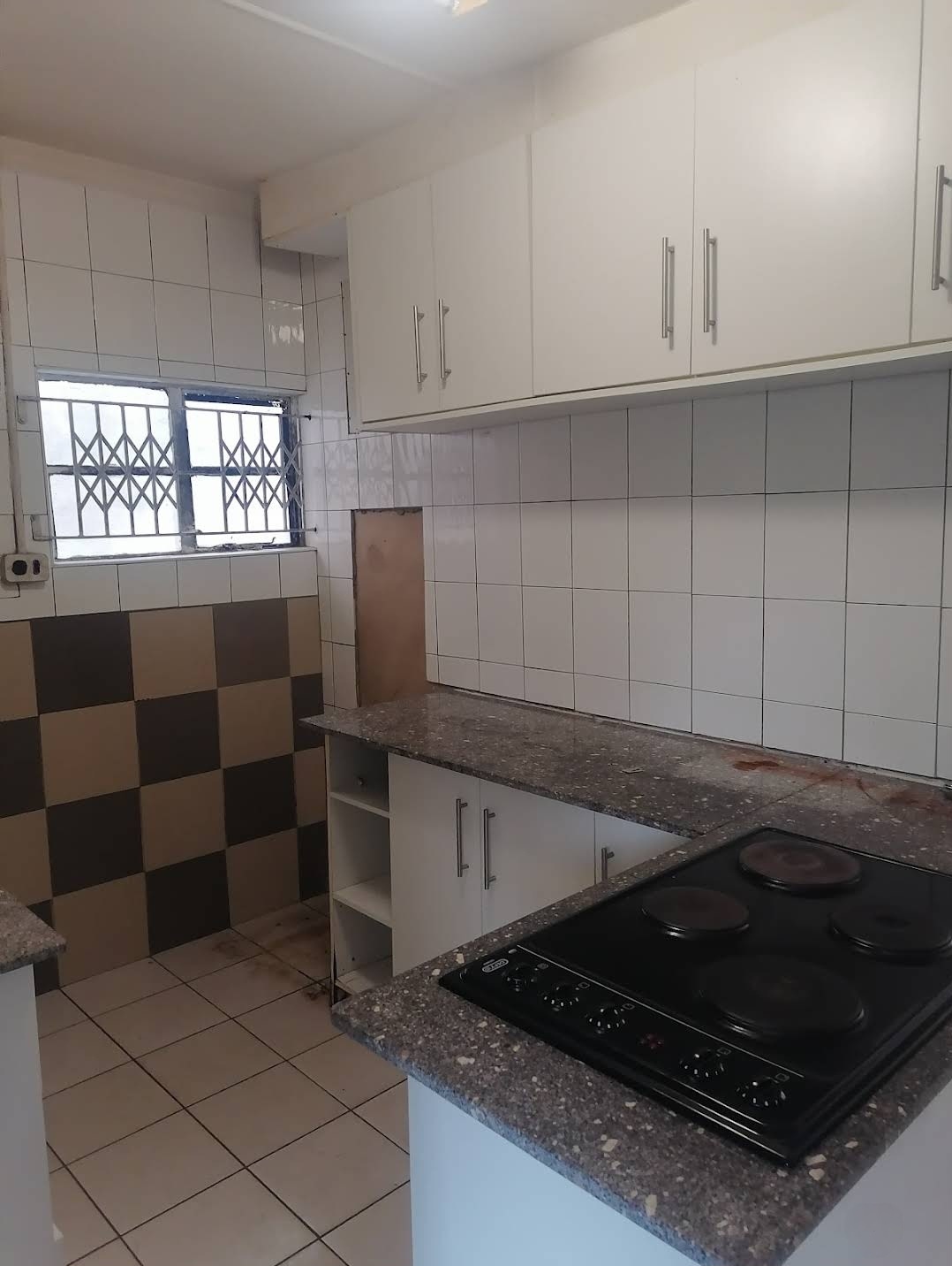 Tiled kitchen with granite countertop